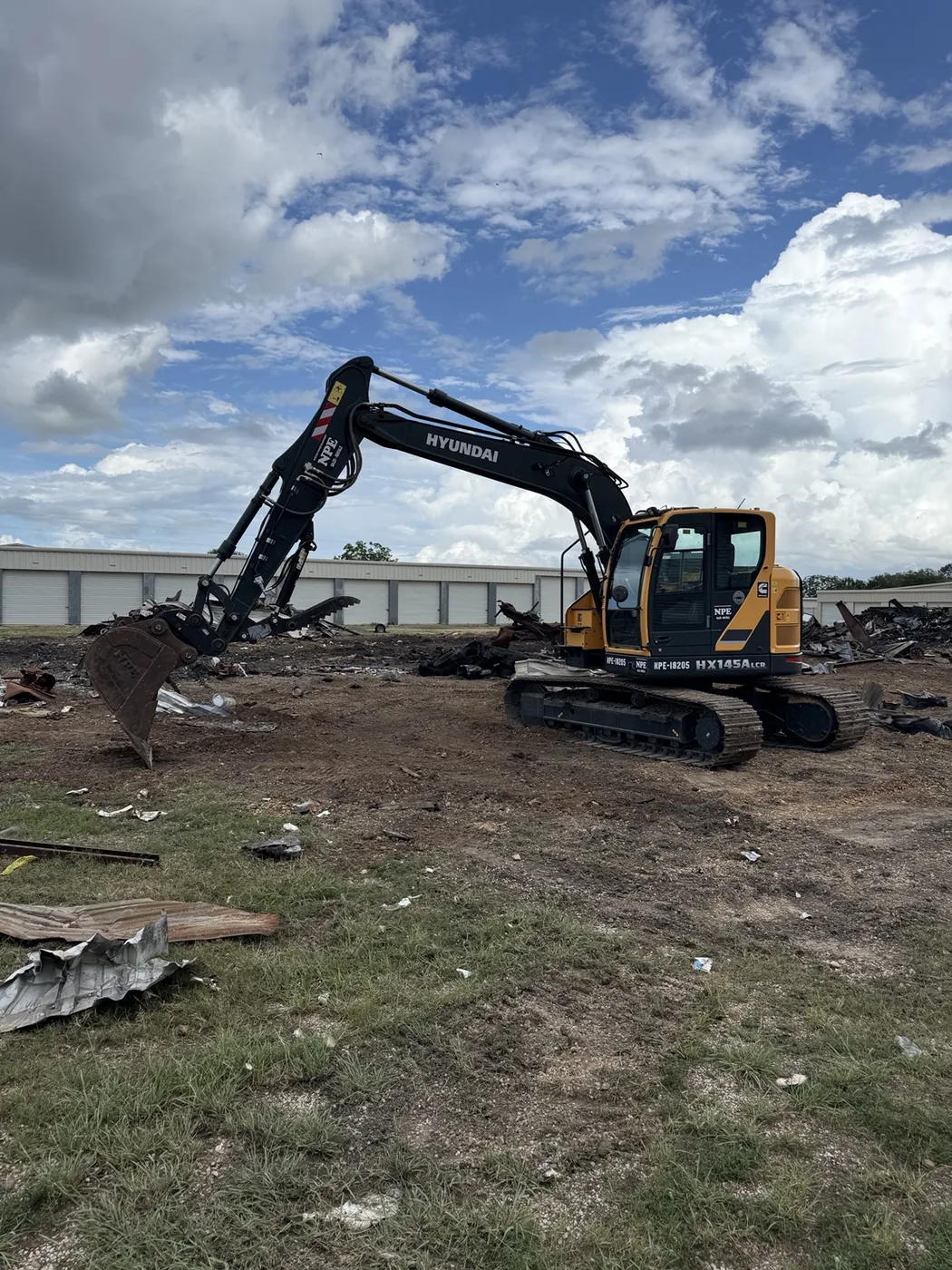 Excavator at demolition cleanup