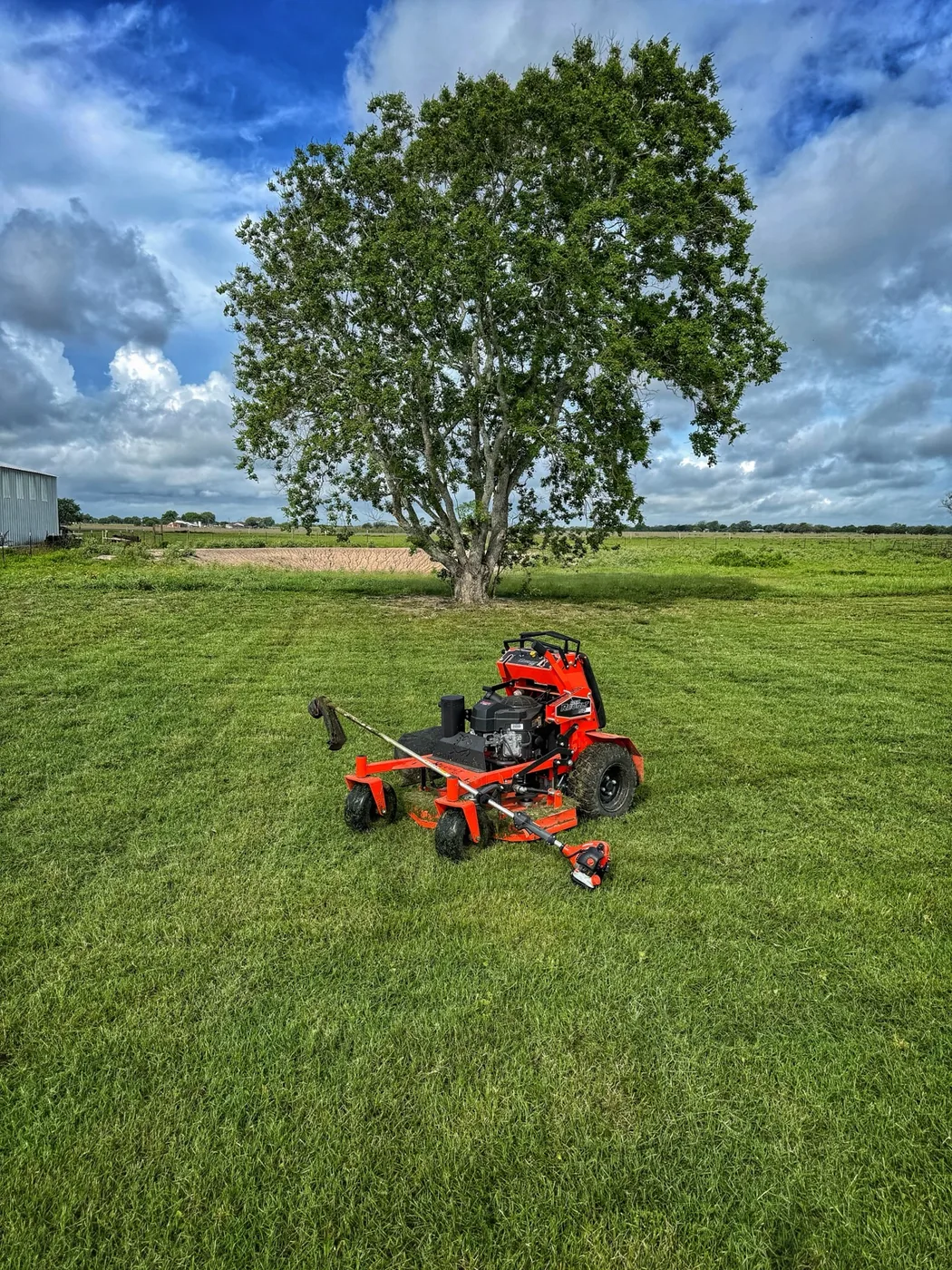 Commercial mower on acreage