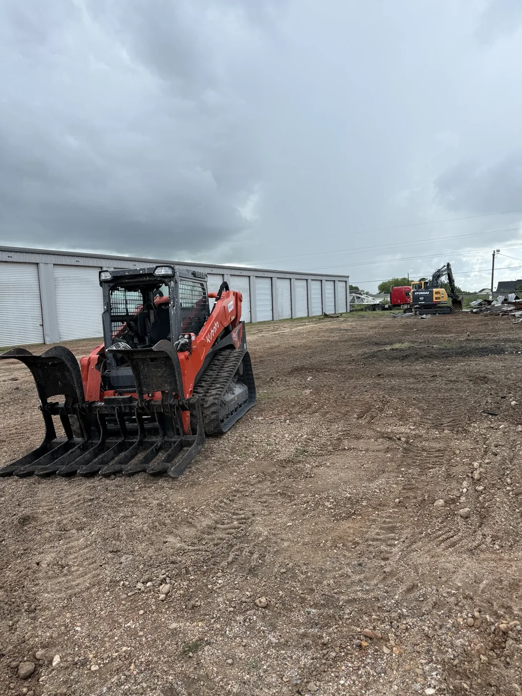 Skid steer on cleanup site